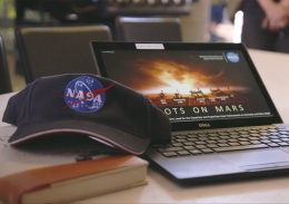 NASA hat and laptop used by the scientists to give students a behind-the-scenes look at what the Perseverance rover will get up to on Mars