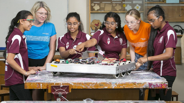 female STEM school students working together