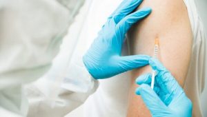 Close up of a vaccine being injected into an arm